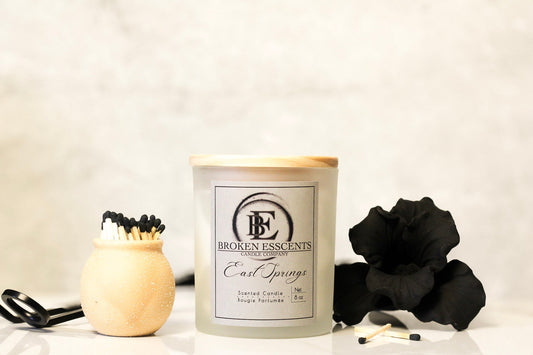 Broken Esscents hand-poured candle glowing in the dark